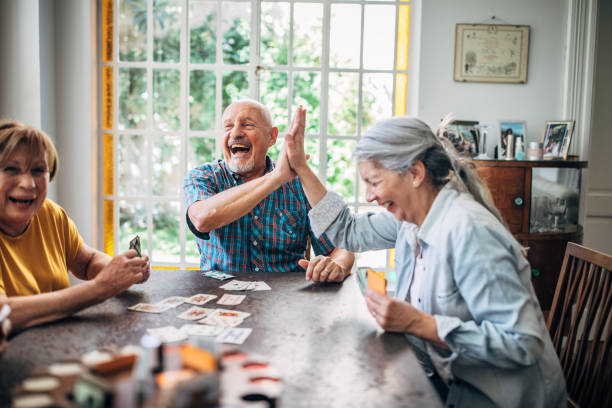 Group of seniors playing cards Group of seniors playing cards